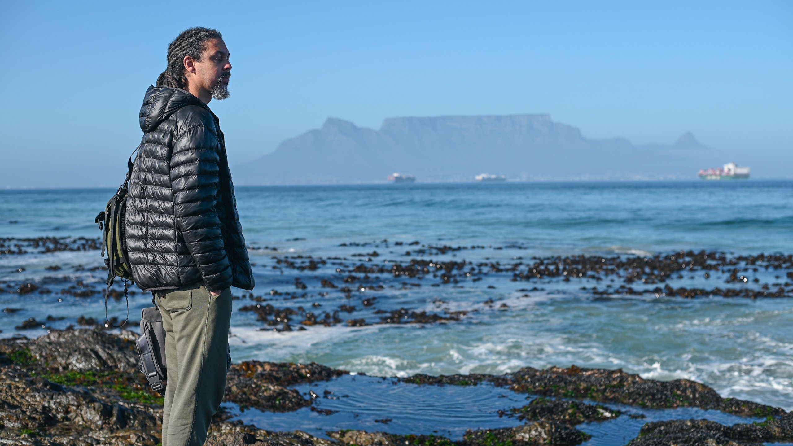 Man seen standing and meditating in nature